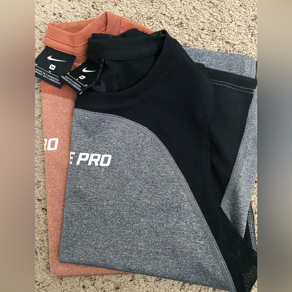 Two Nike Pro Women’s Crop Workout Top